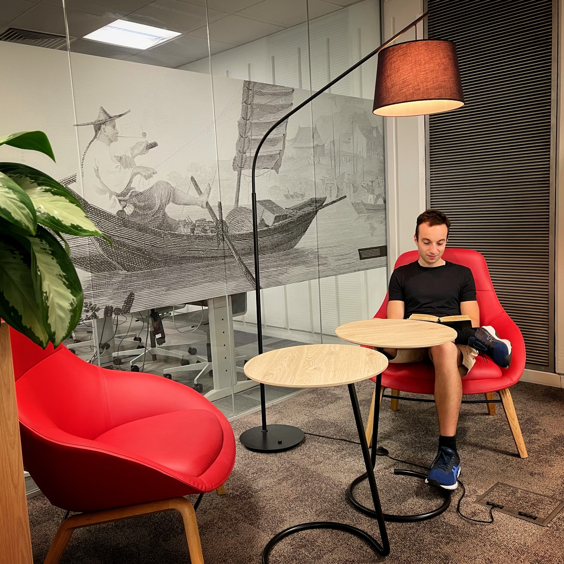 A student sits in the comfortable seating area of the PGR room.